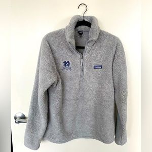 Patagonia fleece with Notre Dame Swimming and Diving decal. Size large.